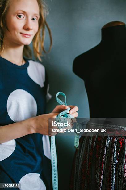 Tailor With Flexible Tape Measure Stock Photo - Download Image Now - 20-24 Years, 2015, Adult