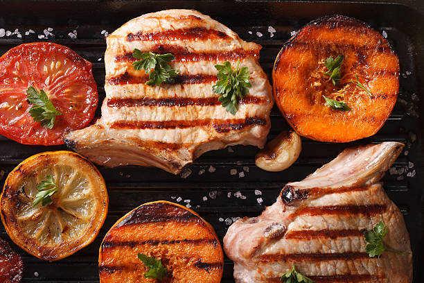 istock Grilled pork and pumpkin on grill. top view horizontal macro 489955348