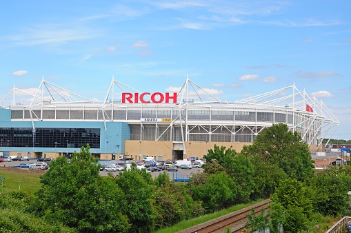 Coventry, United Kingdom - June 4, 2015: View of the Ricoh Arena stadium with people passing by, Coventry, West Midlands, England, UK, Western Europe.