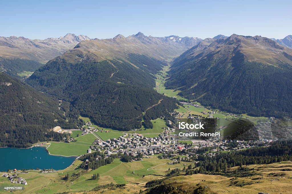 View From Mt. Weissfluhjoch Down To Davos & Lake Davos Taken on August 29th, 2015 - I've spend a few days in the beautiful area of Davos in Graubünden in Switzerland. Wonderful landscape with many mountains and a lake there. Simply perfect for some hiking and biking activity! 2015 Stock Photo