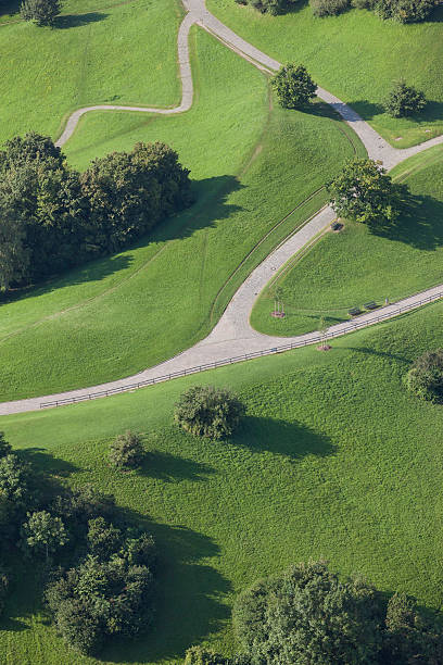 istock Green park with footpath and bifurcation in Munich 489957322