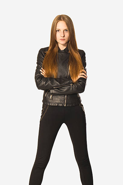 istock Confidence young woman portrait in black. 489958634