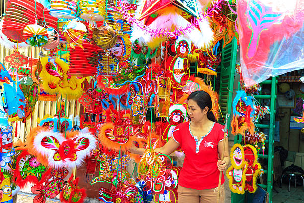 Hochiminh City, Vietnam - September 11, 2015: Paper lanterns for sale on street print HoChiMinh city. The Mid-Autumn street are crowded Festival is for children who receive all before Vietnamese toys, fruit and moon cake as gift