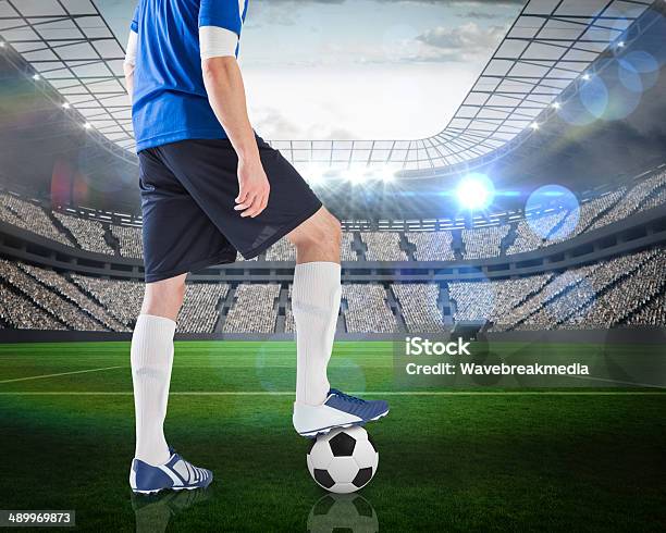 Football Player Standing With Ball Stock Photo - Download Image Now - Rear View, Soccer Player, 20-29 Years