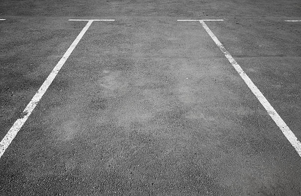 istock Empty parking place with white marking lines on asphalt 489970599