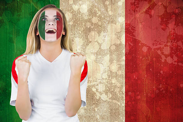 istock Excited italy fan in face paint cheering 489971525