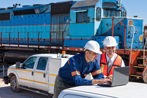 Engineer and Businessman at Railroad Construction Site,Locomotive, Freight Transportation,Investment Strategy,Budget