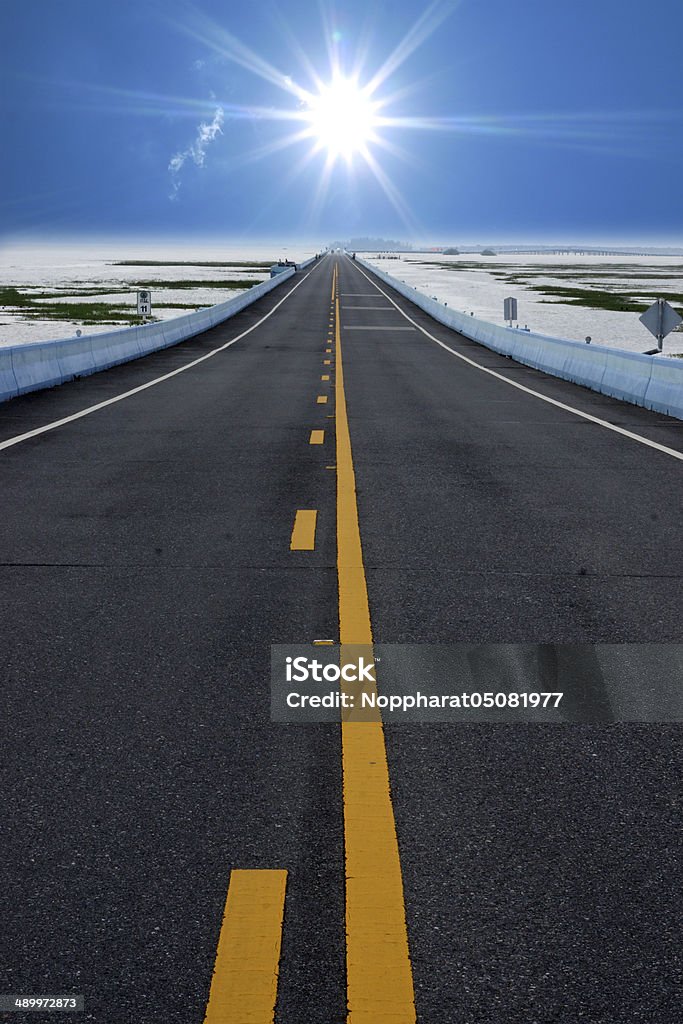 Empty road and the yellow traffic lines. Asphalt Stock Photo