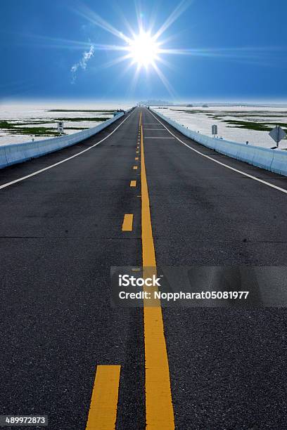 Empty Road And The Yellow Traffic Lines Stock Photo - Download Image Now - Asphalt, Close-up, Concrete