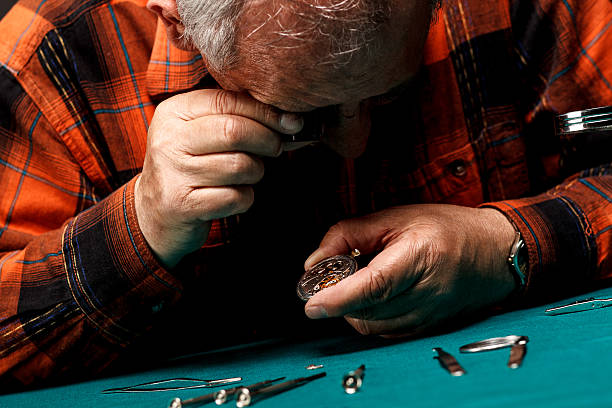 istock Repairing old pocket watch 489973367