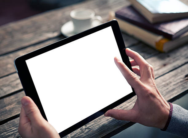 istock Man shows screen of tablet in his hands 489975428