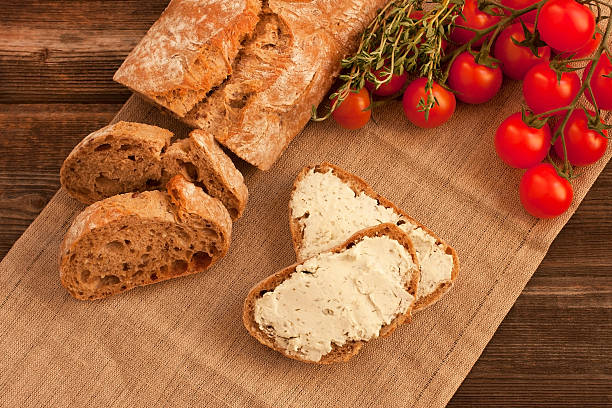 istock Tasty baguette on a wooden board 489975477
