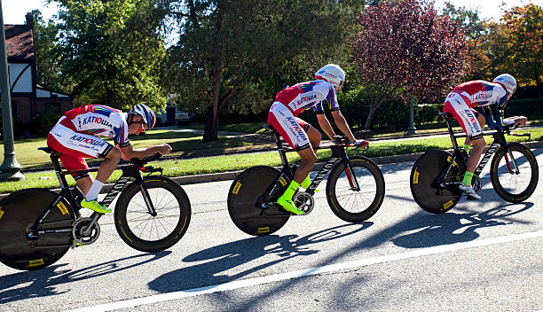 UCI Road World Championships Richmond, Virginia, United States- September 19, 2015: World class men riders wearing red and white cycle up an incline on Hermitage Road in Richmond, Virginia during time trials at the UCI Road World Championships, Saturday September 19, 2015. uci road world championships stock pictures, royalty-free photos & images