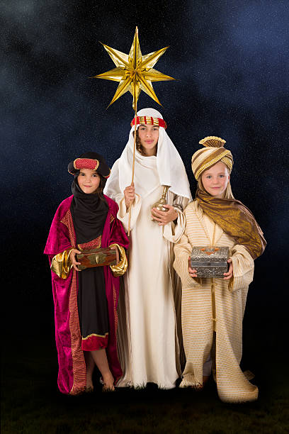Wisemen played by three girls in a live Christmas nativity scene