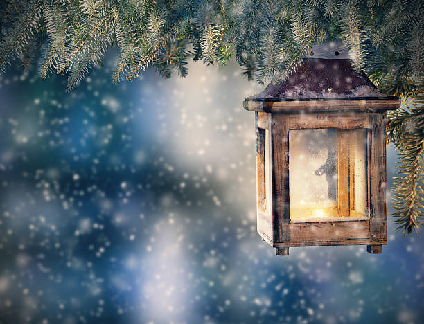 istock Christmas lantern hanging on fir branches 489980898
