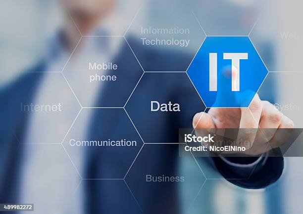 It Consultant Presenting Tag Cloud About Information Technology Stock Photo - Download Image Now