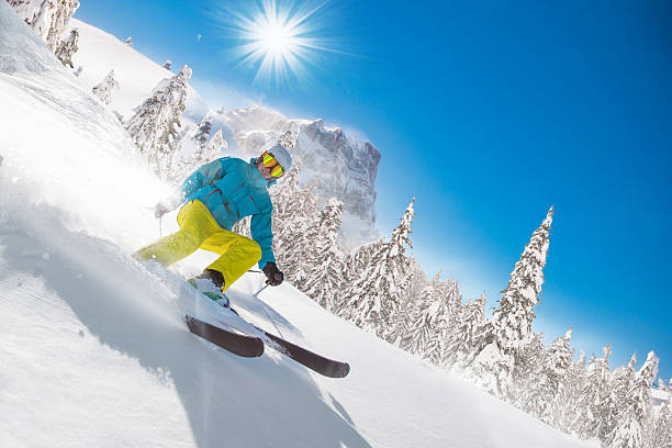 istock Skier skiing downhill in high mountains 489983032