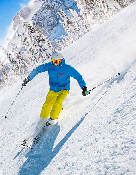 istock Skier skiing downhill in high mountains 489983064