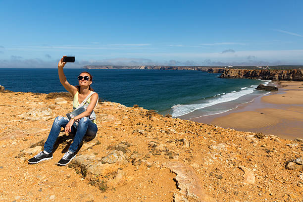 istock Woman making selfie on the beach 489987266
