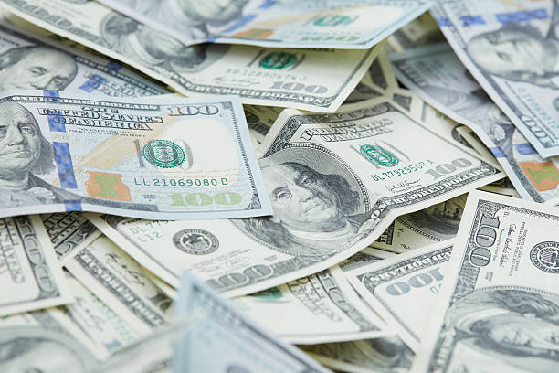 istock background from banknotes of dollars 489988116