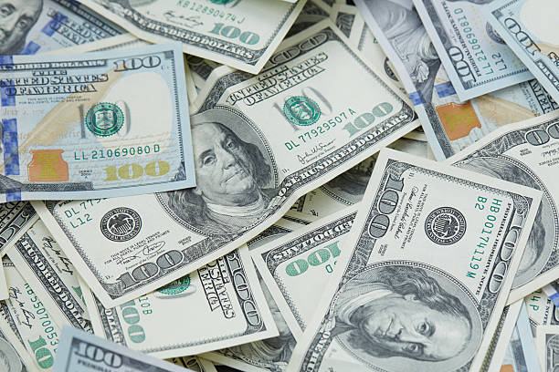 istock background from banknotes of dollars 489988248