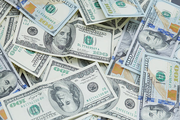 istock background from banknotes of dollars 489988390