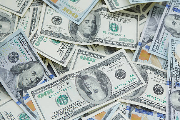 istock background from banknotes of dollars 489988436
