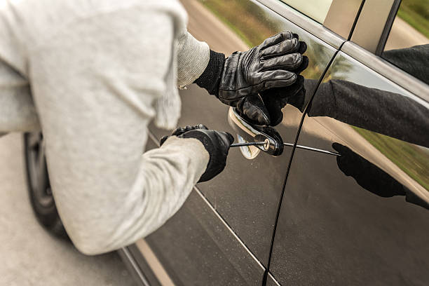 istock Car thief using a screwdriver to brake into a car 489988510