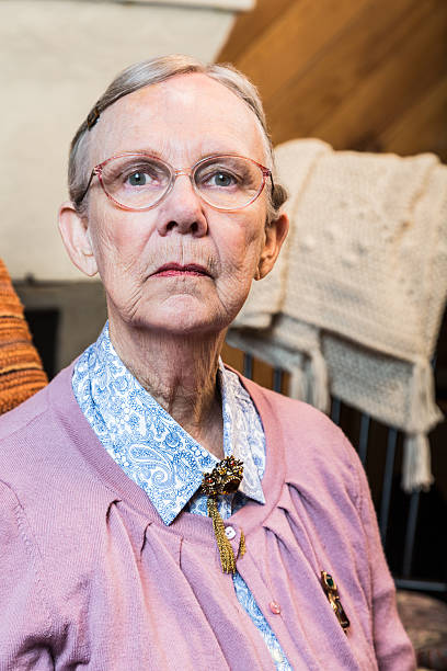 istock Old Woman Sitting Sternly 490014292