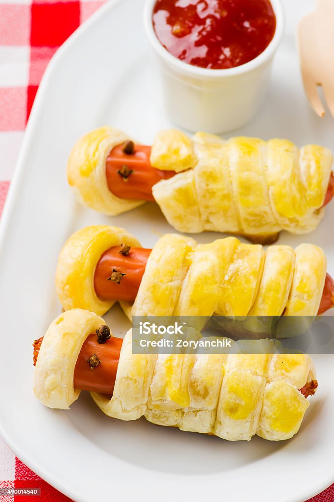 sausage rolls in the form of mummies 2015 Stock Photo