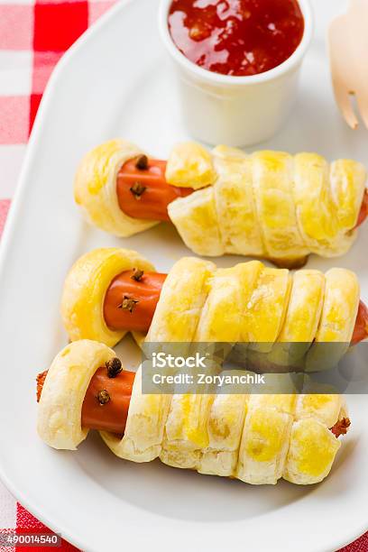 Sausage Rolls In The Form Of Mummies Stock Photo - Download Image Now - 2015, Appetizer, Baked