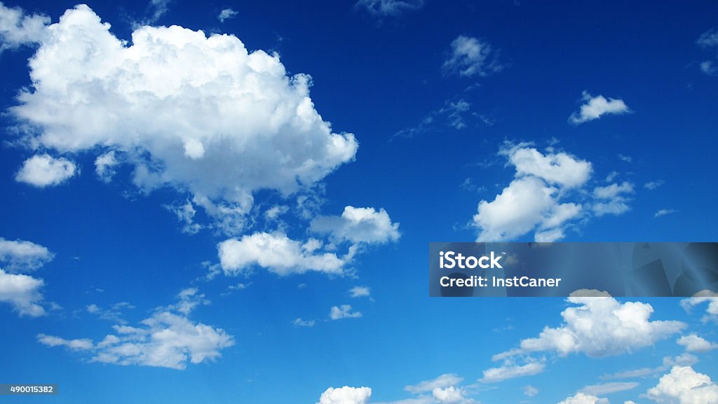 Cumulus Cloudscape Cumulus cloudscape in front of a clear blue sky. Cloud - Sky Stock Photo