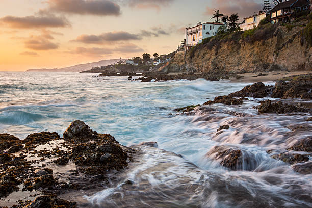 istock Rocky coastal sunset seascape with house on rocks 490019434
