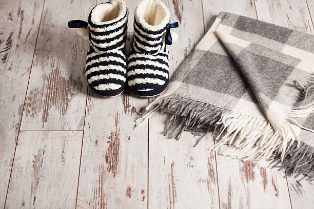istock Warm slippers on the background floor 490021438