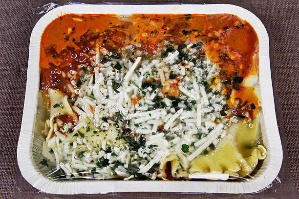 Frozen Lasagna Family Frozen Lasagna Meal Ready To Bake large pasta pot stock pictures, royalty-free photos & images