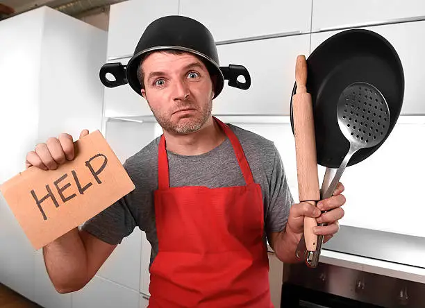 Photo of home cook with pot on head asking for help