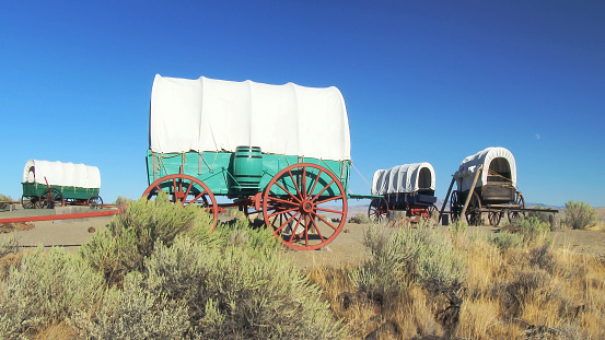 Very old weathered and worn out wagon once used in farming and ranching in rugged Montana in western USA of North America. The nearest cities are Great Falls, Helena, Bozeman, and Billings Montana.