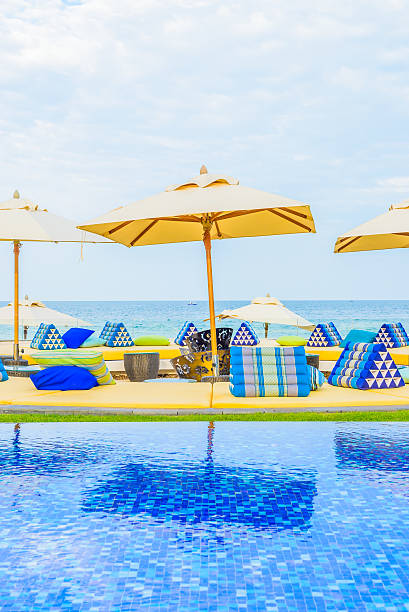 istock Hotel resort swimming pool with umbrella 490025476