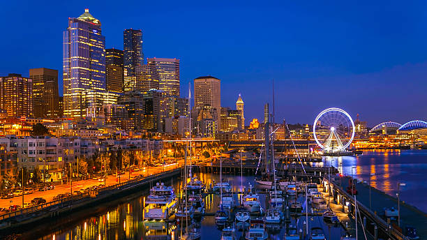 Seattle Waterfront After Sunset After sunset in downtown Seattle tourist area and marina elliott bay photos stock pictures, royalty-free photos & images