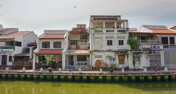 Malacca, Malaysia - August 18, 2014: View of the facade of old buildings at Malaysian town in Malacca. It was listed as a UNESCO World Heritage Site together with George Town on 2008.