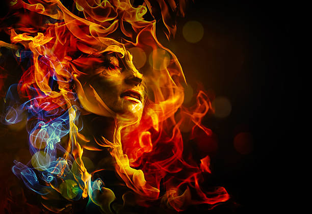 Illustration of woman's face made with fire female face with closed eyes surounded by multicolored flames on a dark background desire photos stock pictures, royalty-free photos & images