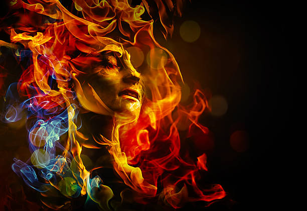 Illustration of woman's face made with fire female face with closed eyes surounded by multicolored flames on a dark background passion stock pictures, royalty-free photos & images