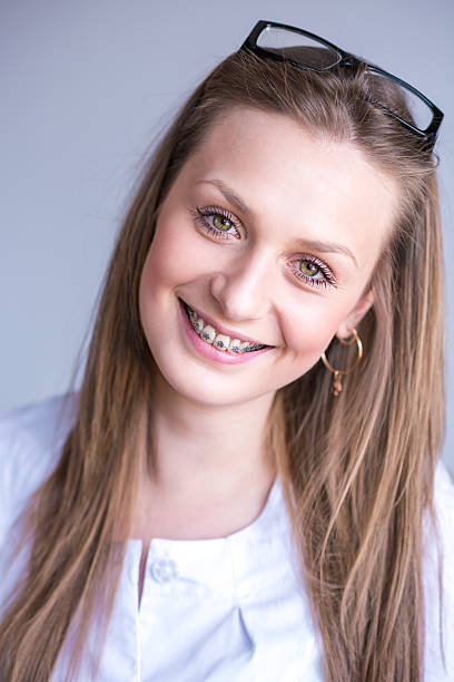 istock happy beautiful girl with braces 490045504