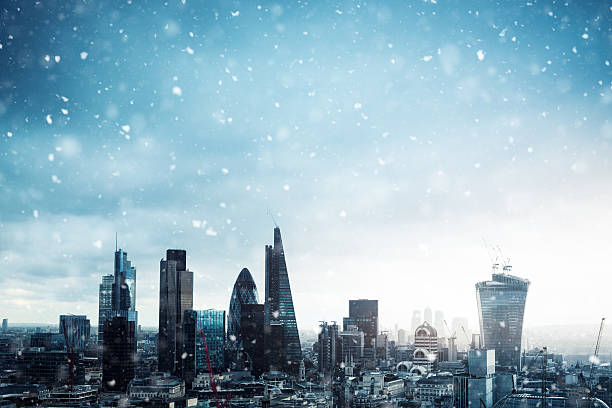 City Of London In Snow City of London in winter time. Snowflakes falling from the sky. winter wonderland london stock pictures, royalty-free photos & images