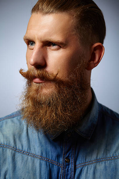 istock Bearded man. Handsome man with a beard and twirled mustache. 490048962