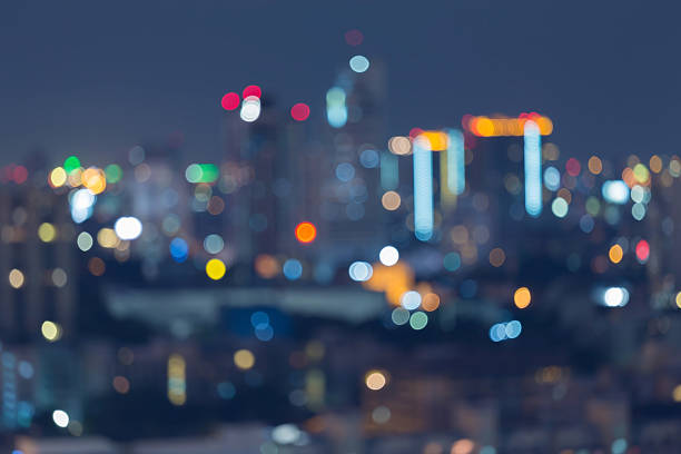 istock Blurred bokeh city light background at night 490050220