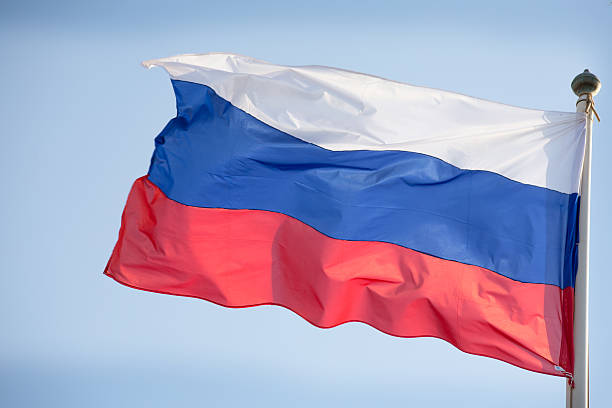 istock Official russian flag on the blue sky background 490051384