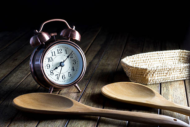 istock Old Alarm Clock and spoon and basket 490052028