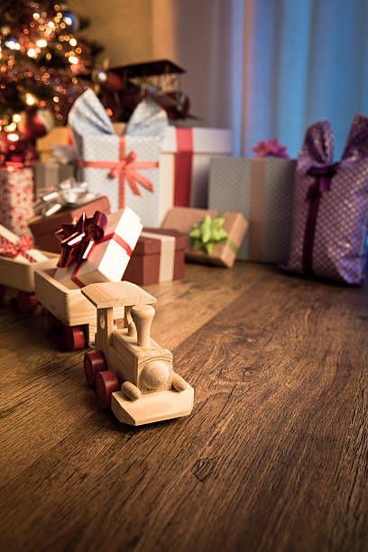 istock Wooden train with christmas gift 490052072