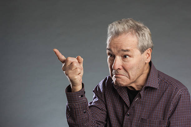 istock Male senior pointing finger angrily as a warning 490053680